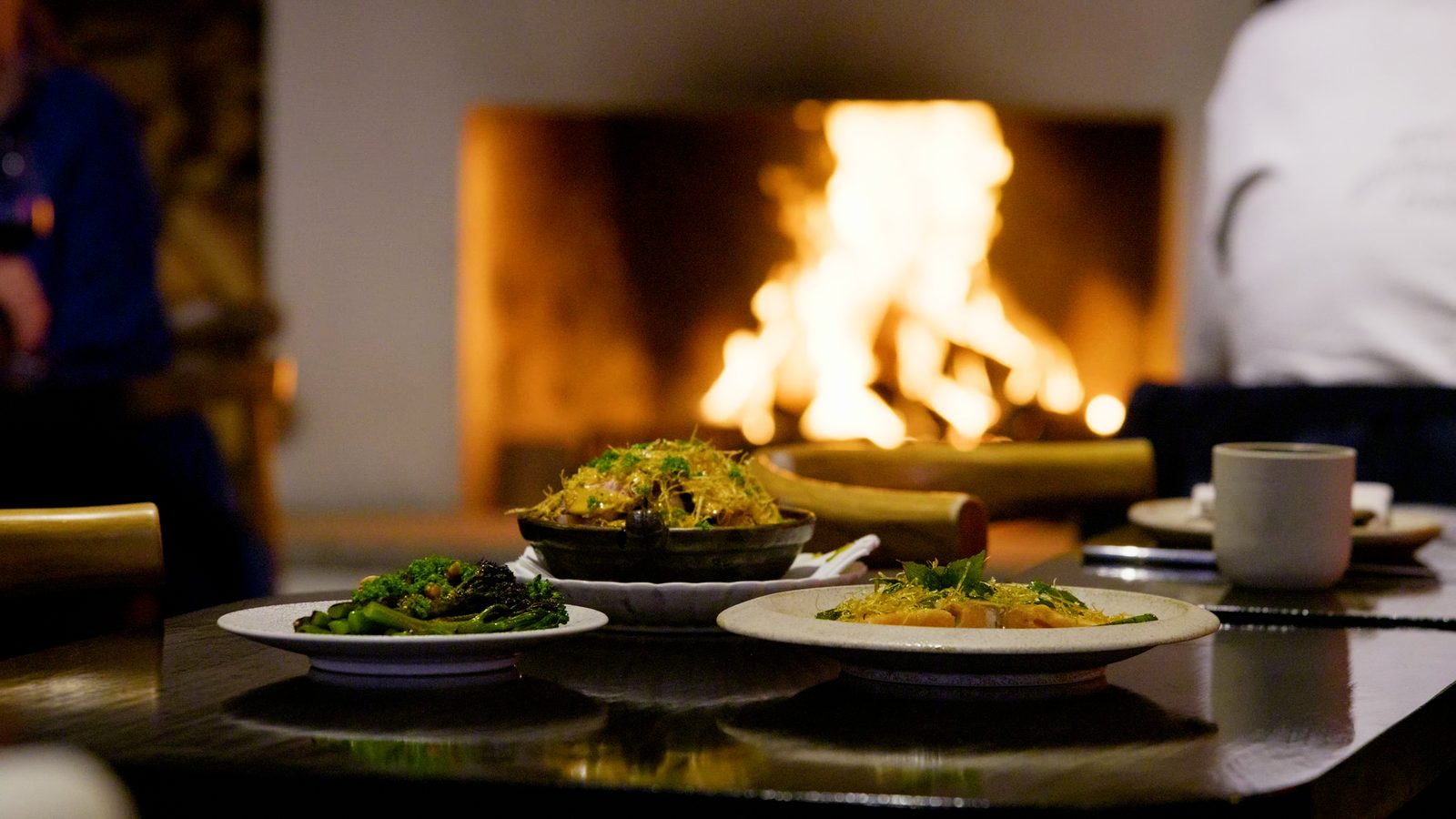 Dishes plated before the open fire at Rothko Restaurant